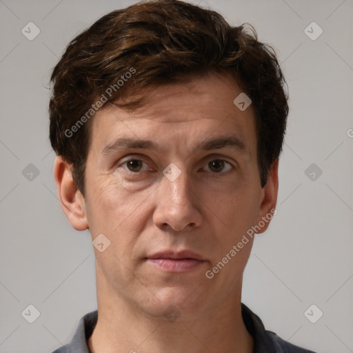 Joyful white adult male with short  brown hair and grey eyes