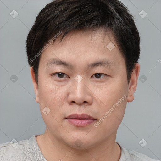 Neutral asian young-adult male with short  brown hair and brown eyes