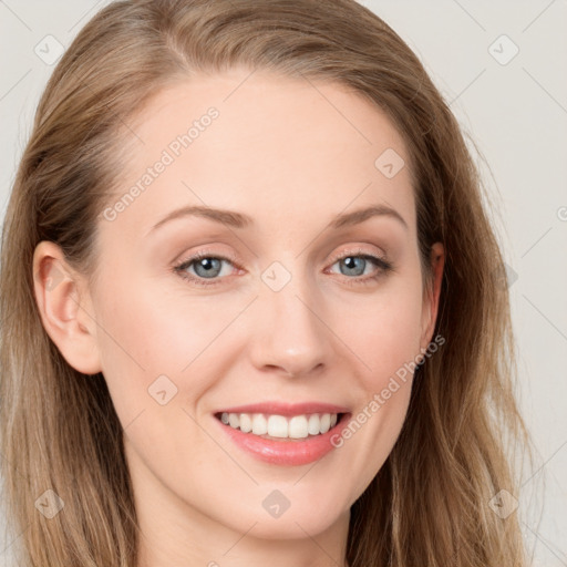 Joyful white young-adult female with long  brown hair and blue eyes