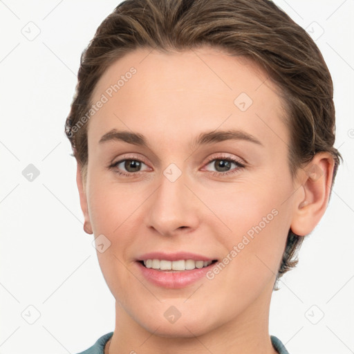 Joyful white young-adult female with short  brown hair and grey eyes