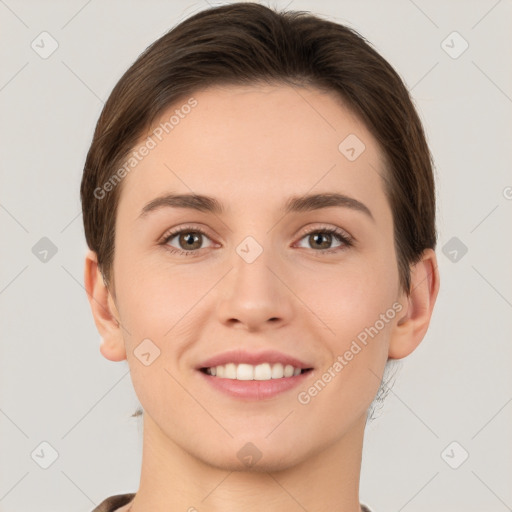 Joyful white young-adult female with short  brown hair and brown eyes