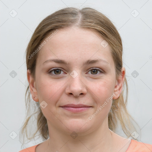 Joyful white young-adult female with medium  brown hair and grey eyes