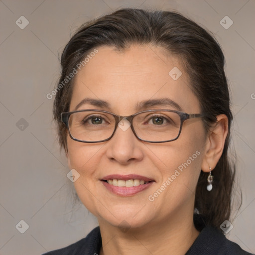 Joyful white adult female with medium  brown hair and brown eyes