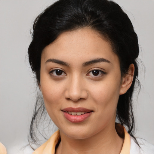 Joyful latino young-adult female with medium  black hair and brown eyes