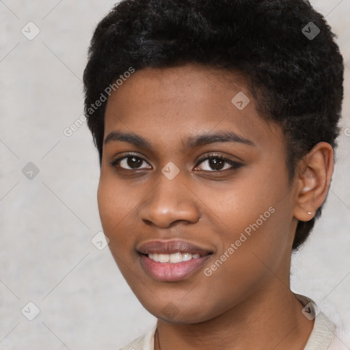 Joyful black young-adult female with short  black hair and brown eyes