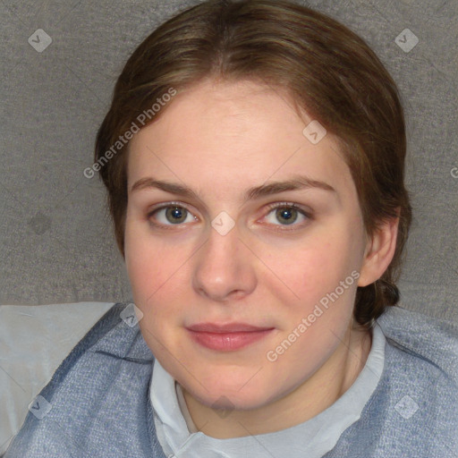 Joyful white young-adult female with short  brown hair and blue eyes