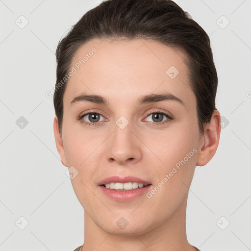 Joyful white young-adult female with short  brown hair and brown eyes