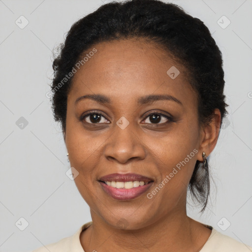 Joyful black adult female with short  black hair and brown eyes