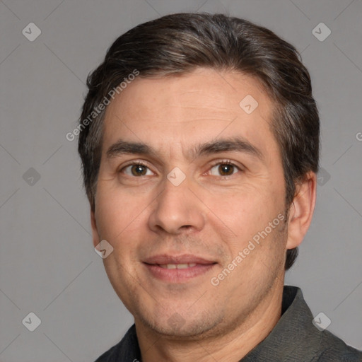 Joyful white adult male with short  brown hair and brown eyes