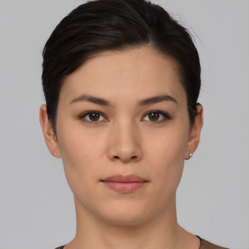 Neutral white young-adult female with short  brown hair and brown eyes