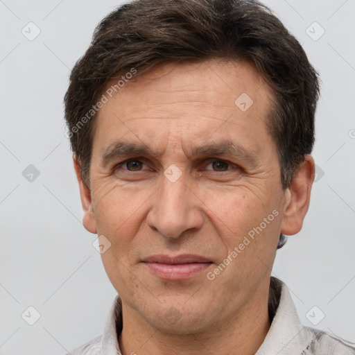 Joyful white adult male with short  brown hair and brown eyes