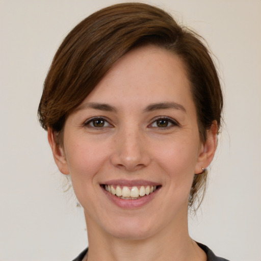 Joyful white young-adult female with medium  brown hair and brown eyes