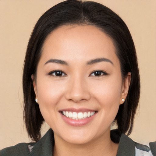 Joyful white young-adult female with medium  black hair and brown eyes