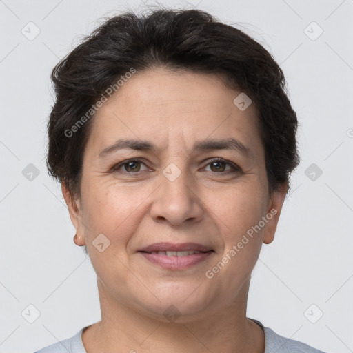 Joyful white adult female with short  brown hair and brown eyes