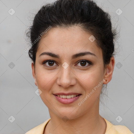 Joyful latino young-adult female with short  brown hair and brown eyes