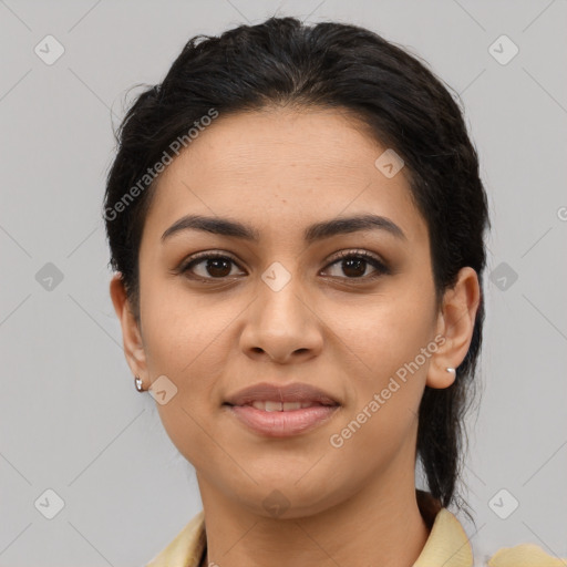 Joyful latino young-adult female with medium  brown hair and brown eyes