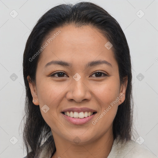 Joyful latino young-adult female with medium  brown hair and brown eyes