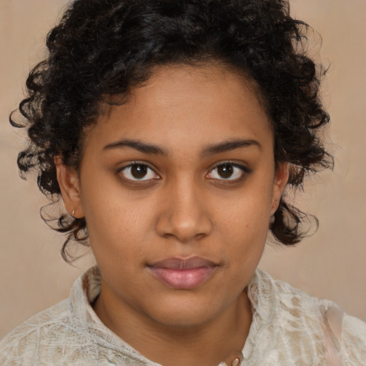 Neutral black young-adult female with medium  brown hair and brown eyes