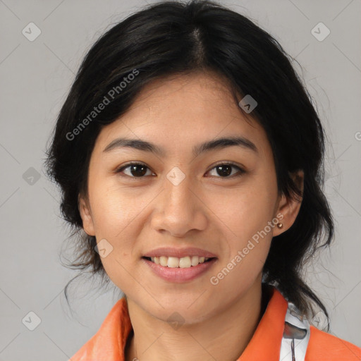 Joyful asian young-adult female with medium  black hair and brown eyes