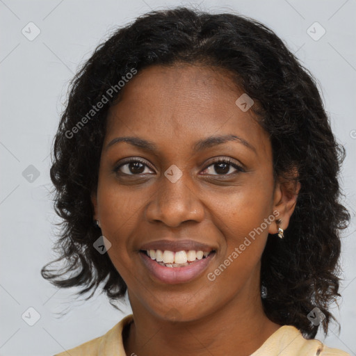 Joyful black young-adult female with medium  brown hair and brown eyes