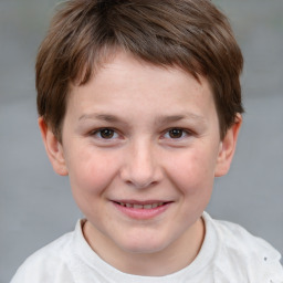 Joyful white child male with short  brown hair and brown eyes