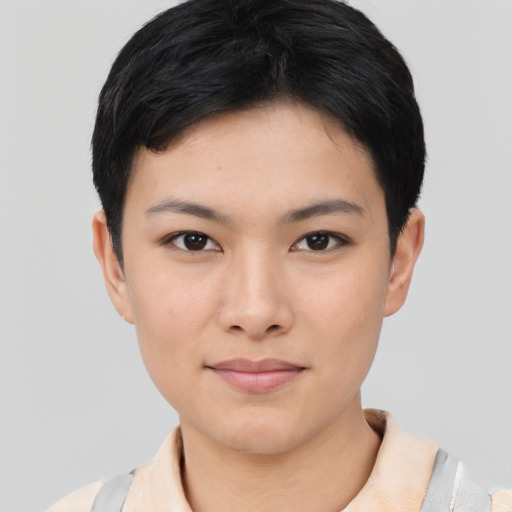 Joyful asian young-adult female with short  black hair and brown eyes