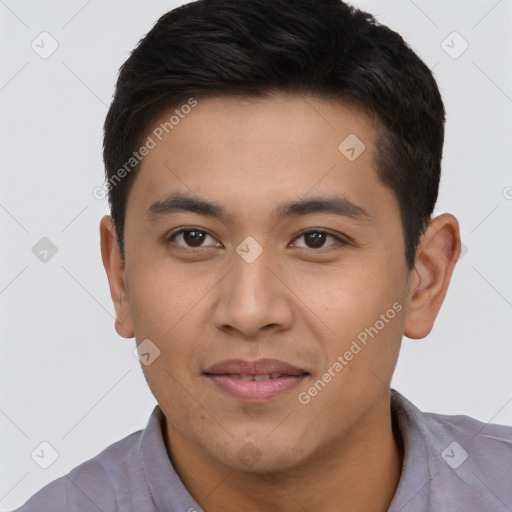 Joyful asian young-adult male with short  black hair and brown eyes