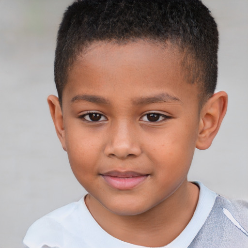 Joyful white child male with short  brown hair and brown eyes