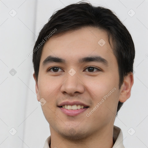 Joyful white young-adult male with short  black hair and brown eyes