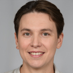 Joyful white adult male with short  brown hair and grey eyes