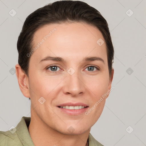 Joyful white young-adult female with short  brown hair and grey eyes