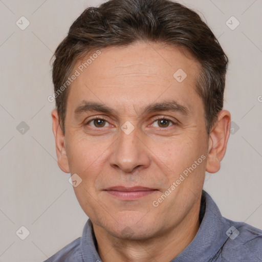 Joyful white adult male with short  brown hair and brown eyes