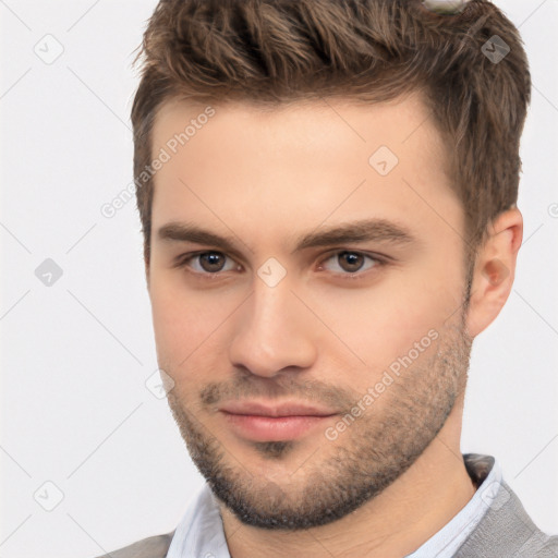 Neutral white young-adult male with short  brown hair and brown eyes