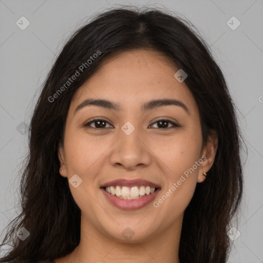 Joyful latino young-adult female with long  brown hair and brown eyes