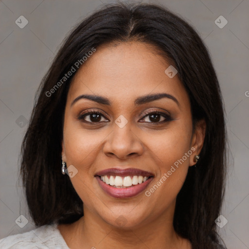 Joyful latino young-adult female with medium  brown hair and brown eyes