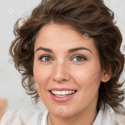 Joyful white young-adult female with medium  brown hair and green eyes