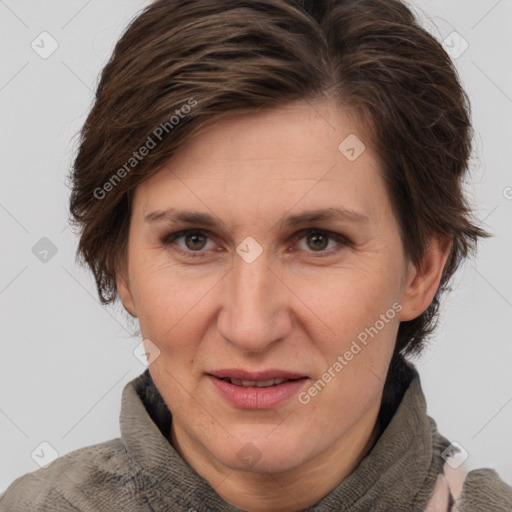 Joyful white adult female with short  brown hair and grey eyes