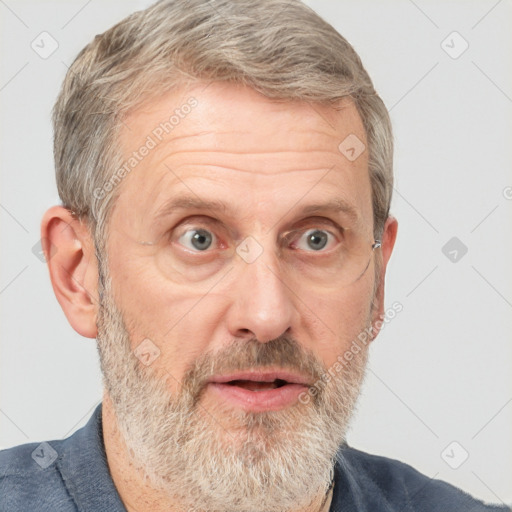 Joyful white middle-aged male with short  gray hair and brown eyes