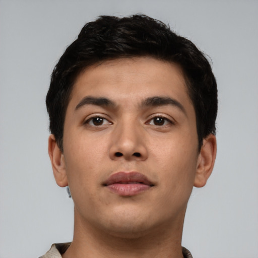 Neutral latino young-adult male with short  brown hair and brown eyes