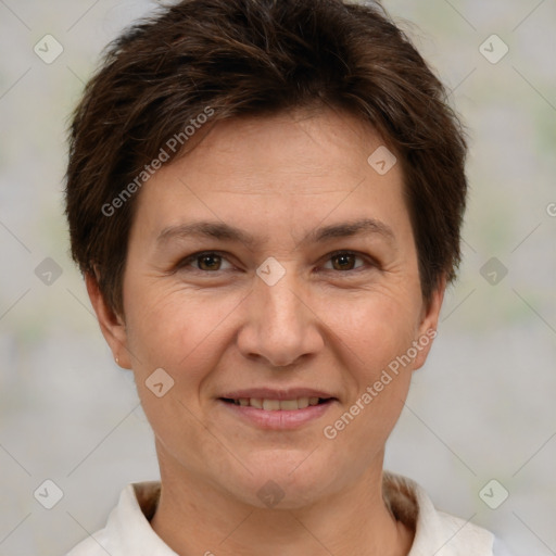 Joyful white adult female with short  brown hair and brown eyes