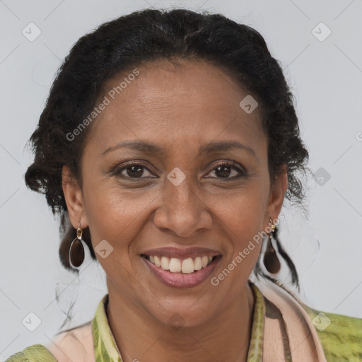 Joyful latino adult female with medium  brown hair and brown eyes