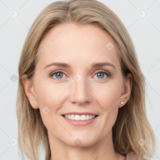 Joyful white young-adult female with long  brown hair and blue eyes