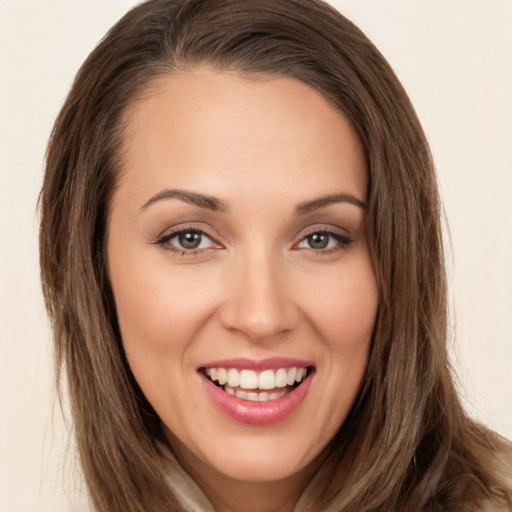 Joyful white young-adult female with long  brown hair and brown eyes