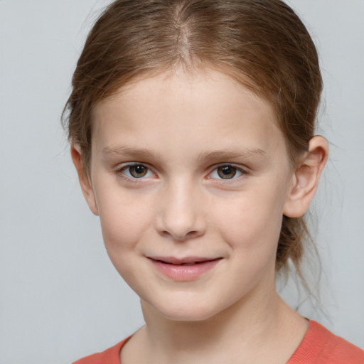 Joyful white child female with medium  brown hair and grey eyes