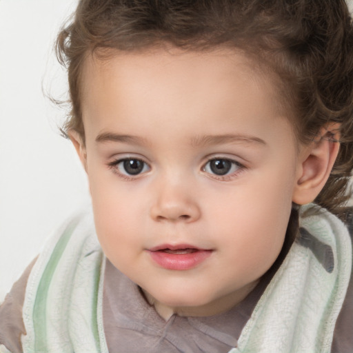 Joyful white child female with short  brown hair and brown eyes