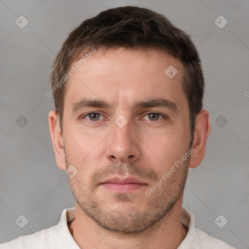 Neutral white young-adult male with short  brown hair and brown eyes