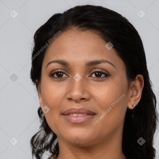 Joyful latino young-adult female with long  brown hair and brown eyes