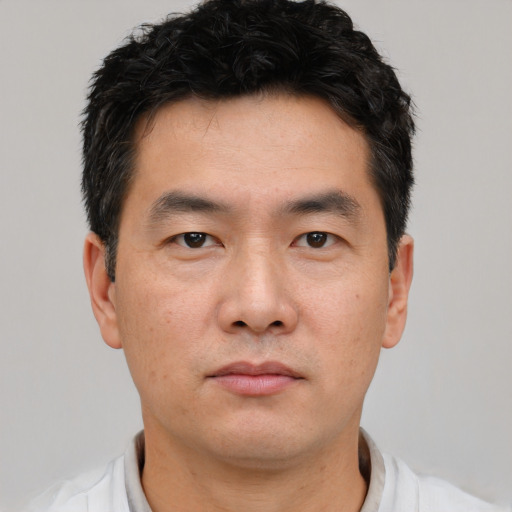Neutral asian young-adult male with short  black hair and brown eyes