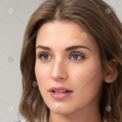 Neutral white young-adult female with long  brown hair and brown eyes