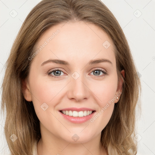 Joyful white young-adult female with long  brown hair and green eyes